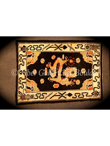 Antique Tibetan dragon rug (18thC)